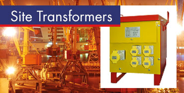 Yellow site transformer with multiple sockets, shown in front of an industrial construction site.